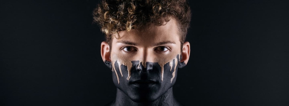 boy with painted face part black