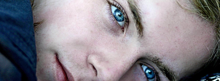 tight shot of face of blue-eyed guy