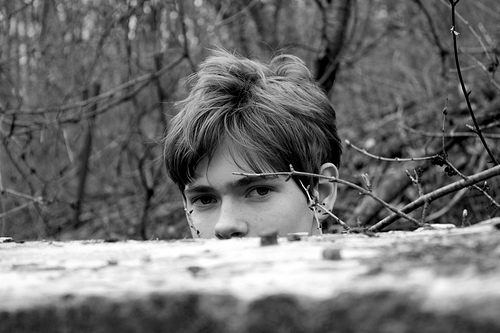 boy looking over ledge