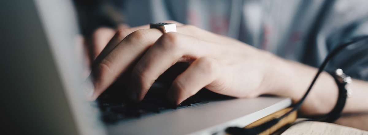 Hands on laptop keyboard